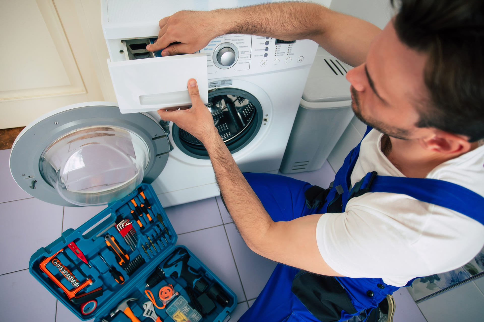 young-handsome-repairman-worker-suit-with-professional-tools-box-is-fixing-washing-machine-bathroom-2
